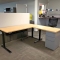 PRE-OWNED ELECTRIC HEIGHT DESK WITH PRIVACY PANEL (Image 1)